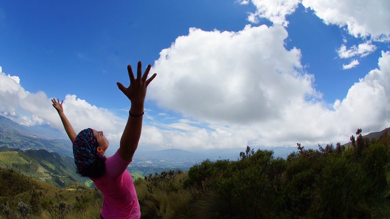 woman reaching to the sky